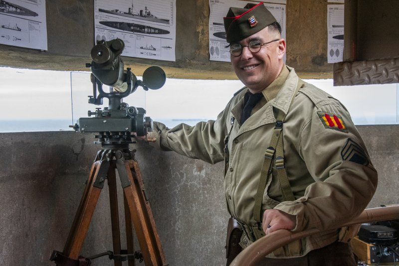 Thomas Minton of Gettysburg, Pa., offers U.S. Army STEM history in the World War II fire control tower during the Fort Miles Defense Day event. Yes, he carried the heavy boxes, including the telescopes, up the steps.